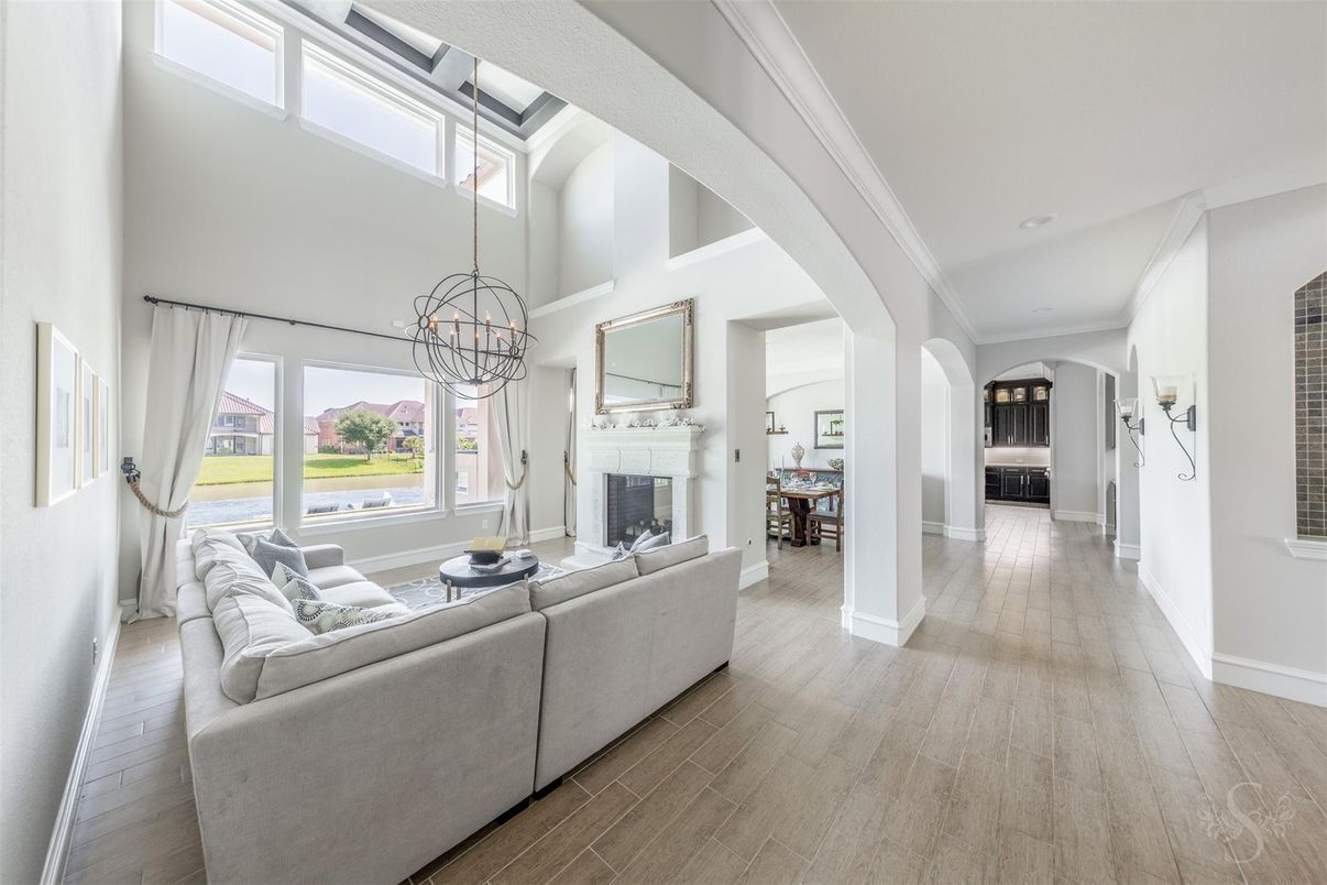 Chandelier, Fireplace, Interior, Living room, Pendant Lights, Recessed Lighting, Wood Texture Flooring