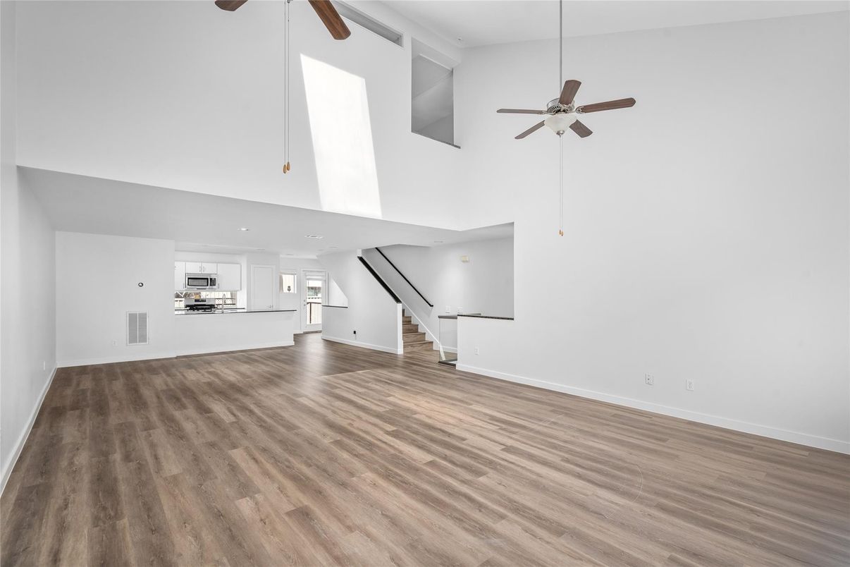 Empty room, Interior, Kitchen, Stainless Steel Appliances, Wood Texture Flooring