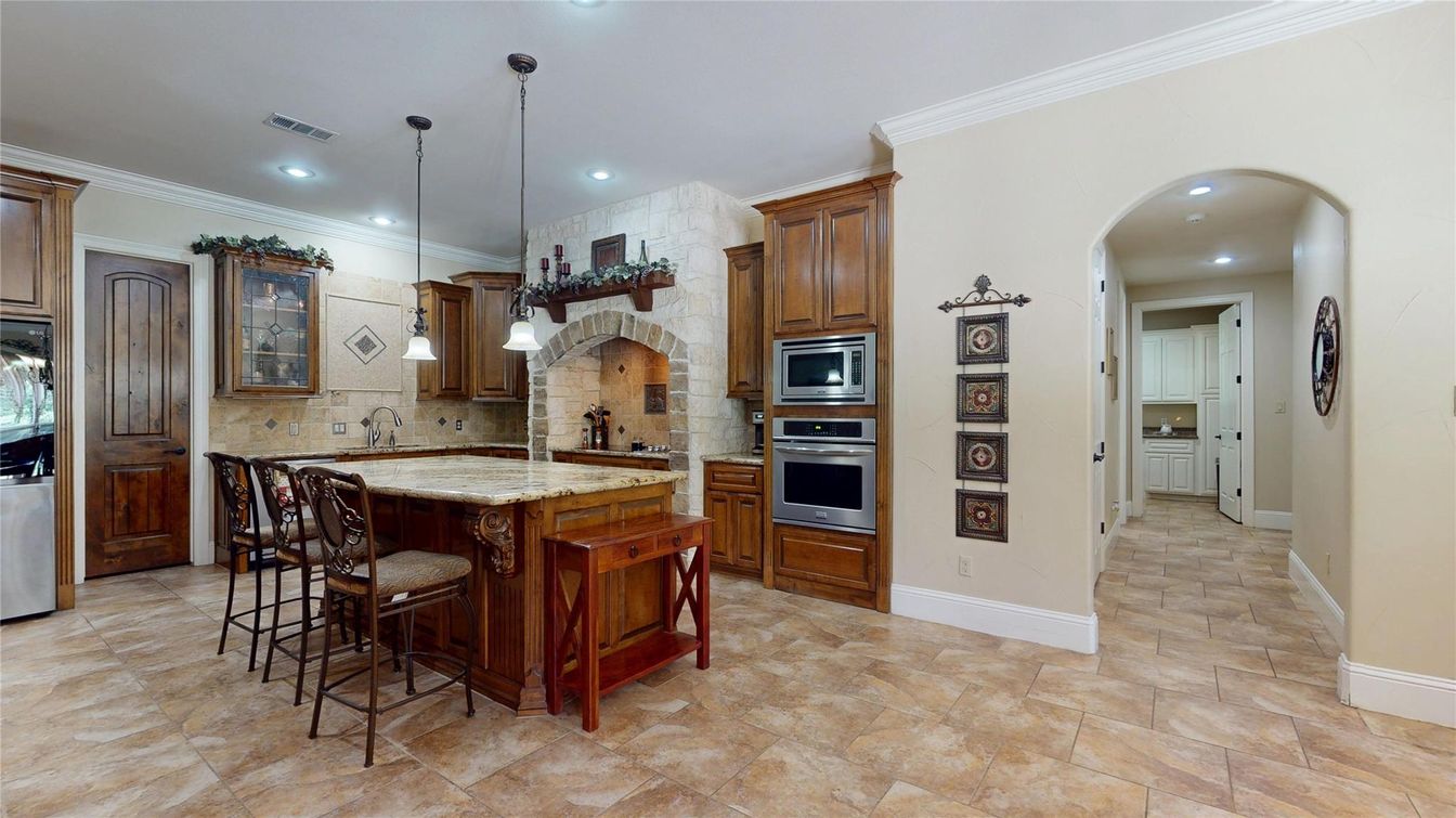 Interior, Kitchen, Pendant Lights, Recessed Lighting, Stainless Steel Appliances, Stone Walls