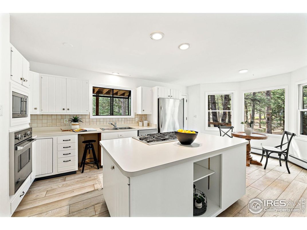 Dining room, Interior, Kitchen, Recessed Lighting, Stainless Steel Appliances, Wood Texture Flooring