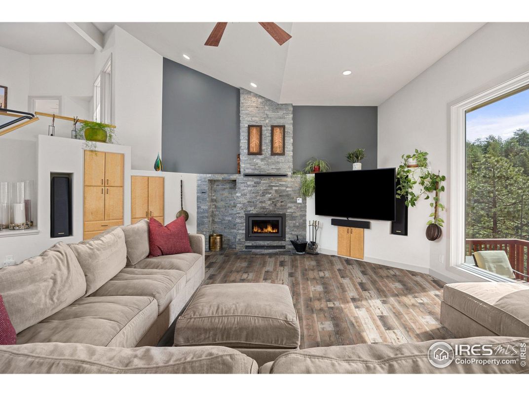 Fireplace, Interior, Living room, Recessed Lighting, Stone Walls, Wood Texture Flooring