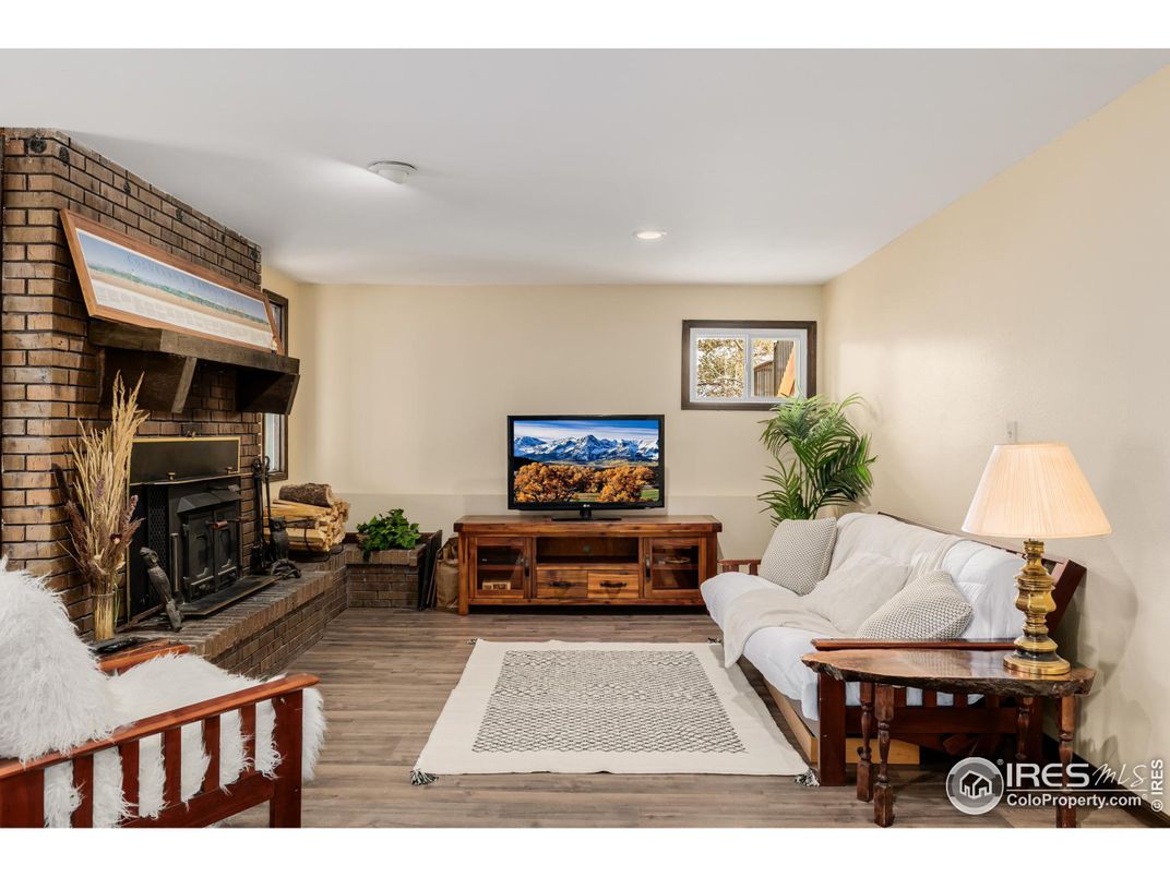 Fireplace, Interior, Living room, Recessed Lighting, Stone Walls, Wood Texture Flooring