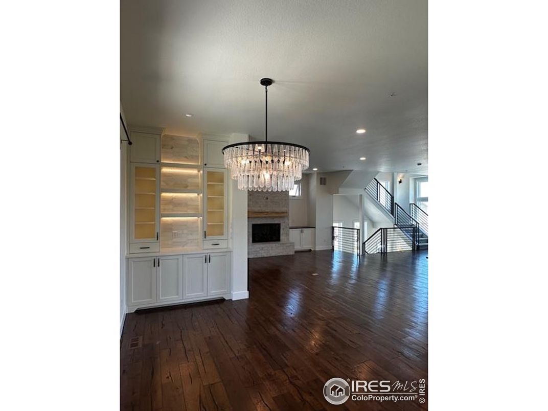 Chandelier, Empty room, Fireplace, Interior, Recessed Lighting, Wood Texture Flooring