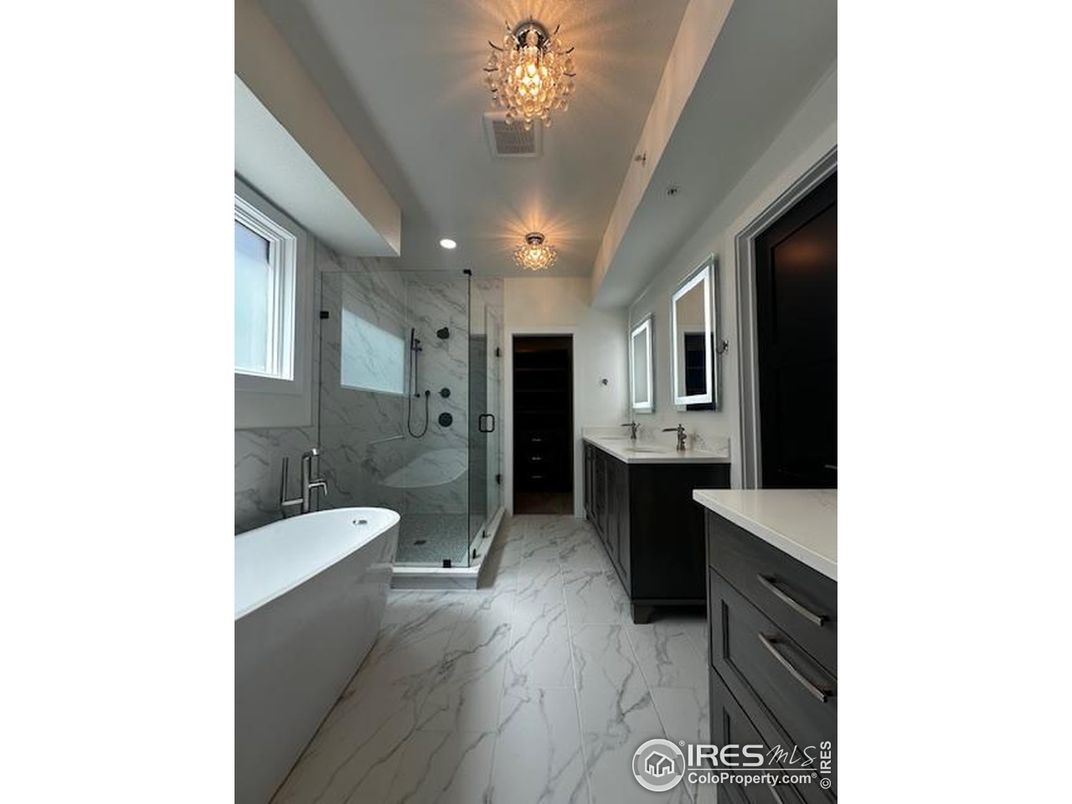 Bathroom, Dual Sink Vanities, Free Standing Baths, Glass Shower, Interior, Marble, Marble Walls, Recessed Lighting
