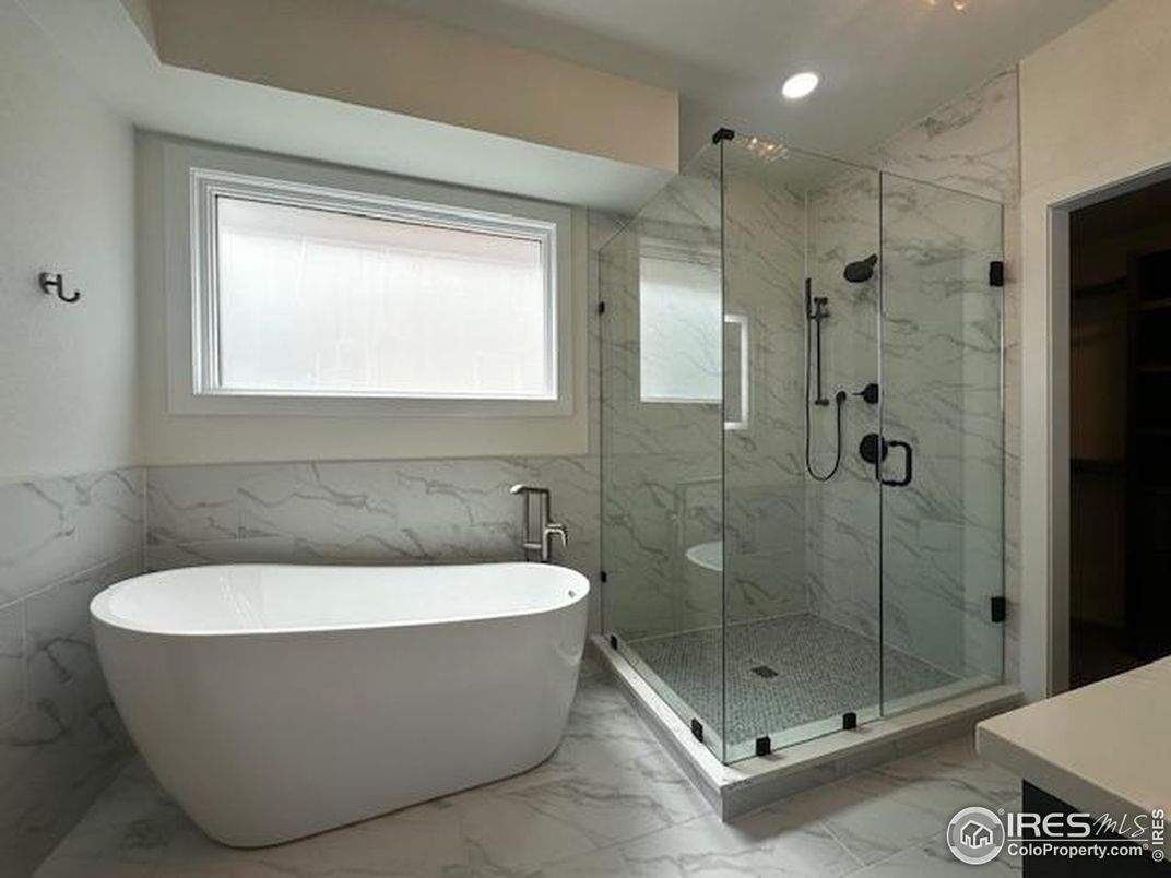 Bathroom, Free Standing Baths, Glass Shower, Interior, Marble, Marble Walls, Recessed Lighting