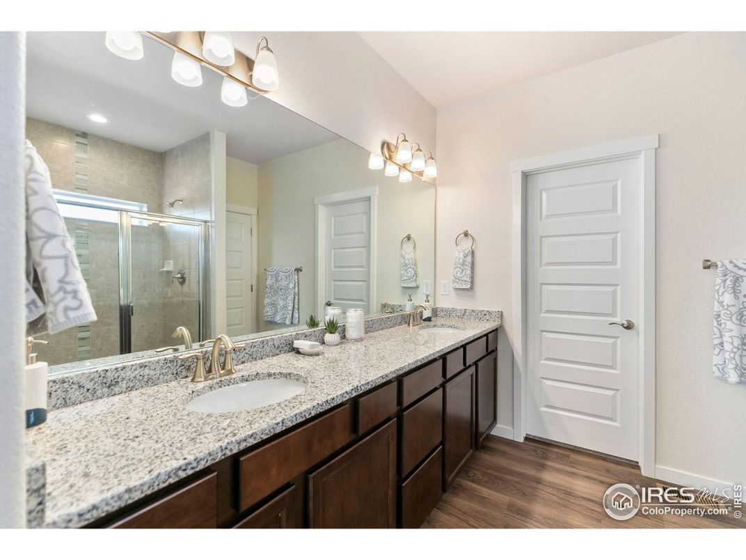 Bathroom, Dual Sink Vanities, Glass Shower, Interior, Recessed Lighting, Wood Texture Flooring