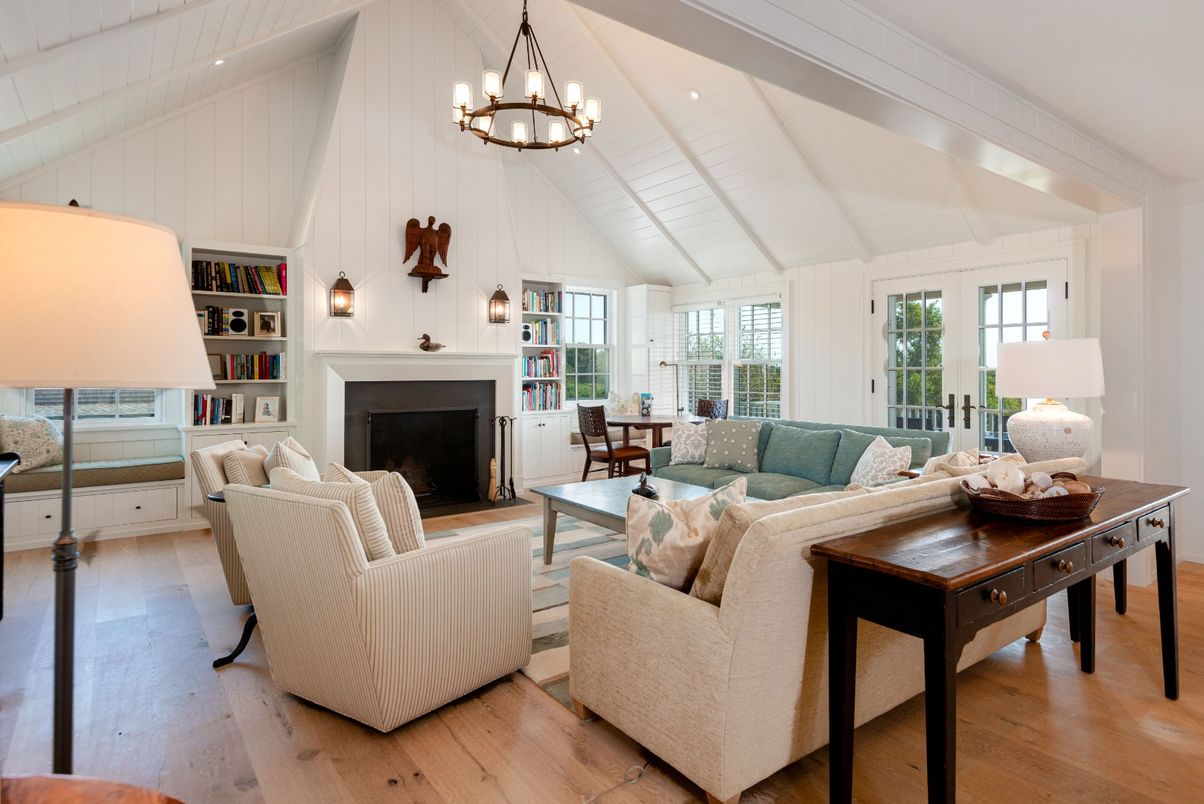 Chandelier, Dining room, Fireplace, Interior, Living room, Pendant Lights, Recessed Lighting, Wood Texture Flooring