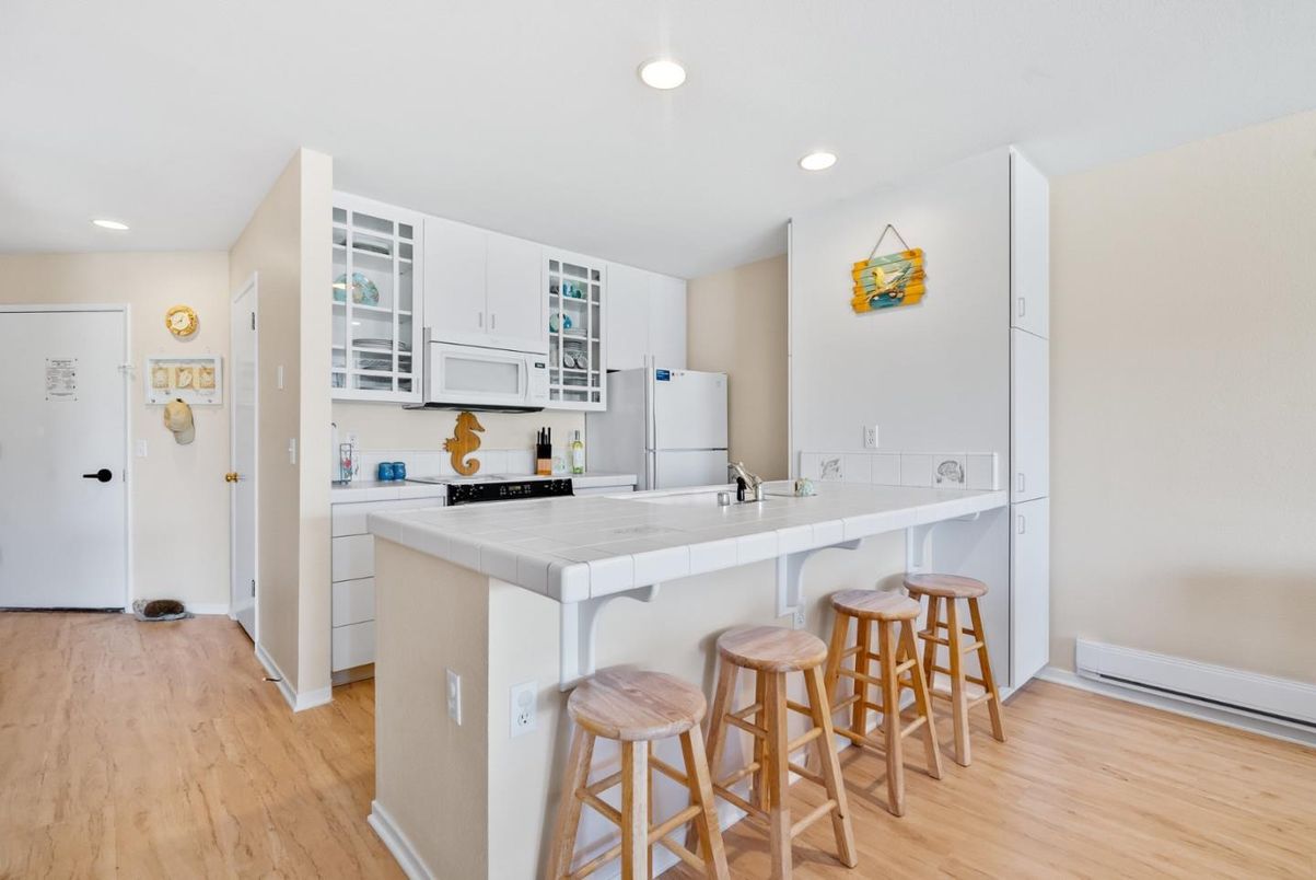 Interior, Kitchen, Recessed Lighting, Tile Countertops, Wood Texture Flooring