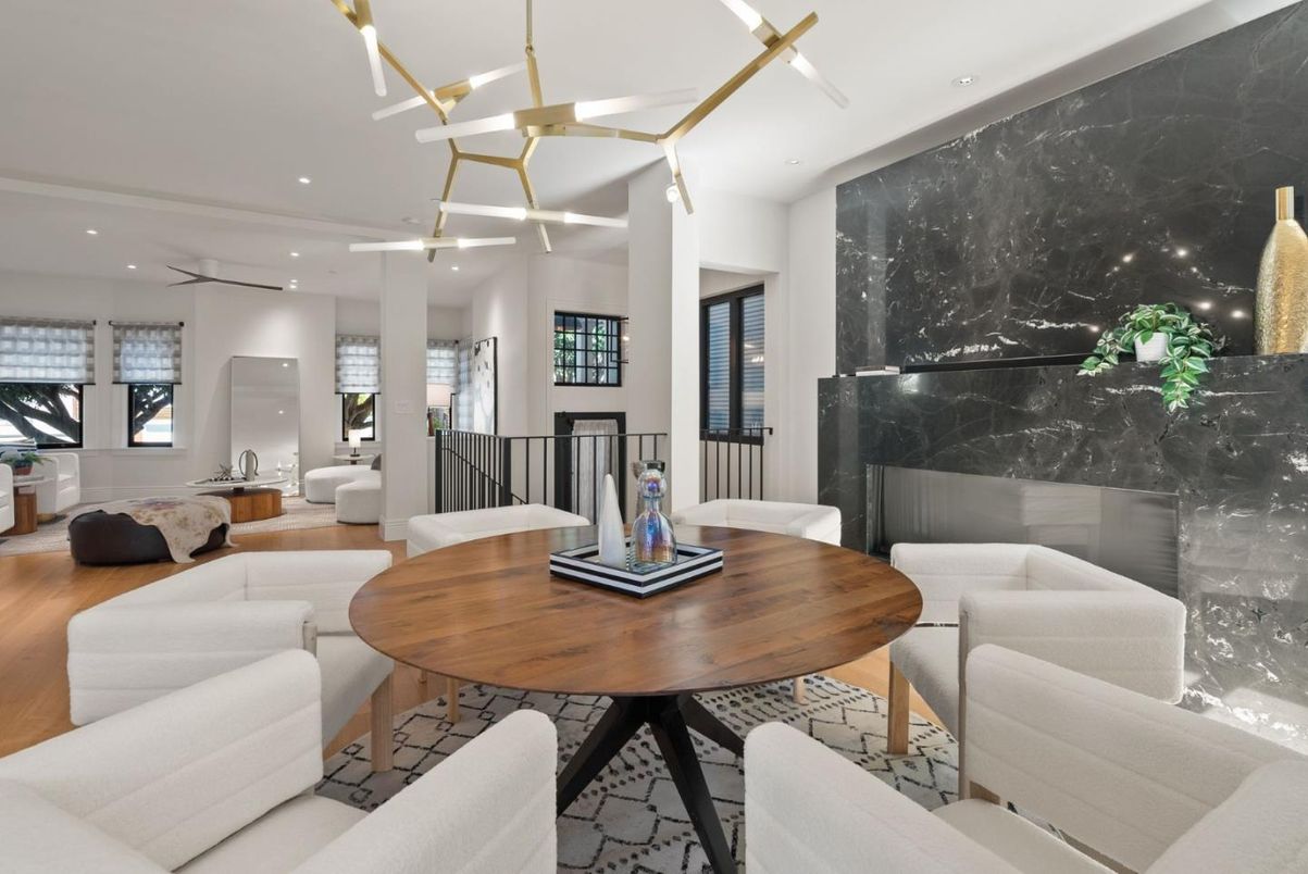 Dining room, Fireplace, Interior, Living room, Marble Walls, Pendant Lights, Recessed Lighting, Wood Texture Flooring