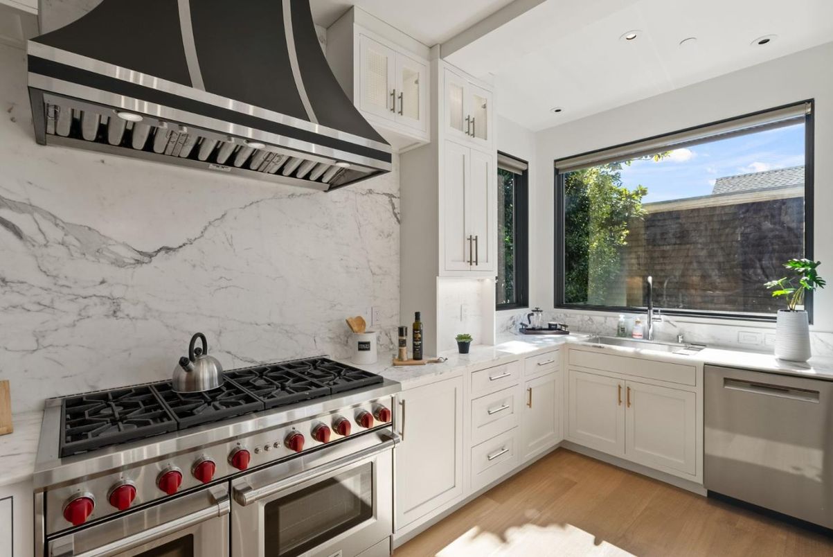 Interior, Kitchen, Marble Walls, Recessed Lighting, Stainless Steel Appliances, Wood Texture Flooring