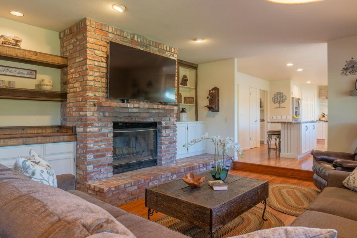 Fireplace, Interior, Living room, Recessed Lighting, Stone Walls, Wood Texture Flooring