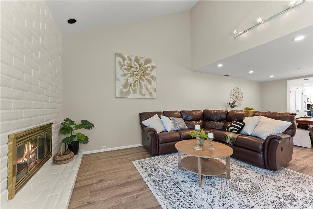 Fireplace, Interior, Living room, Recessed Lighting, Stone Walls, Wood Texture Flooring