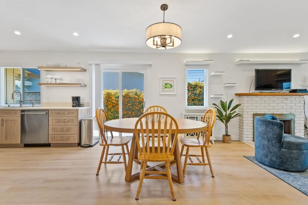 Dining room, Fireplace, Interior, Kitchen, Pendant Lights, Recessed Lighting, Stainless Steel Appliances, Stone Walls, Wood Texture Flooring