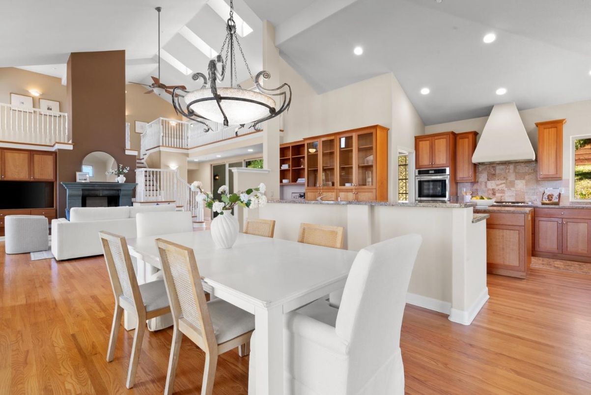Dining room, Fireplace, Interior, Kitchen, Living room, Pendant Lights, Recessed Lighting, Stainless Steel Appliances, Wood Texture Flooring