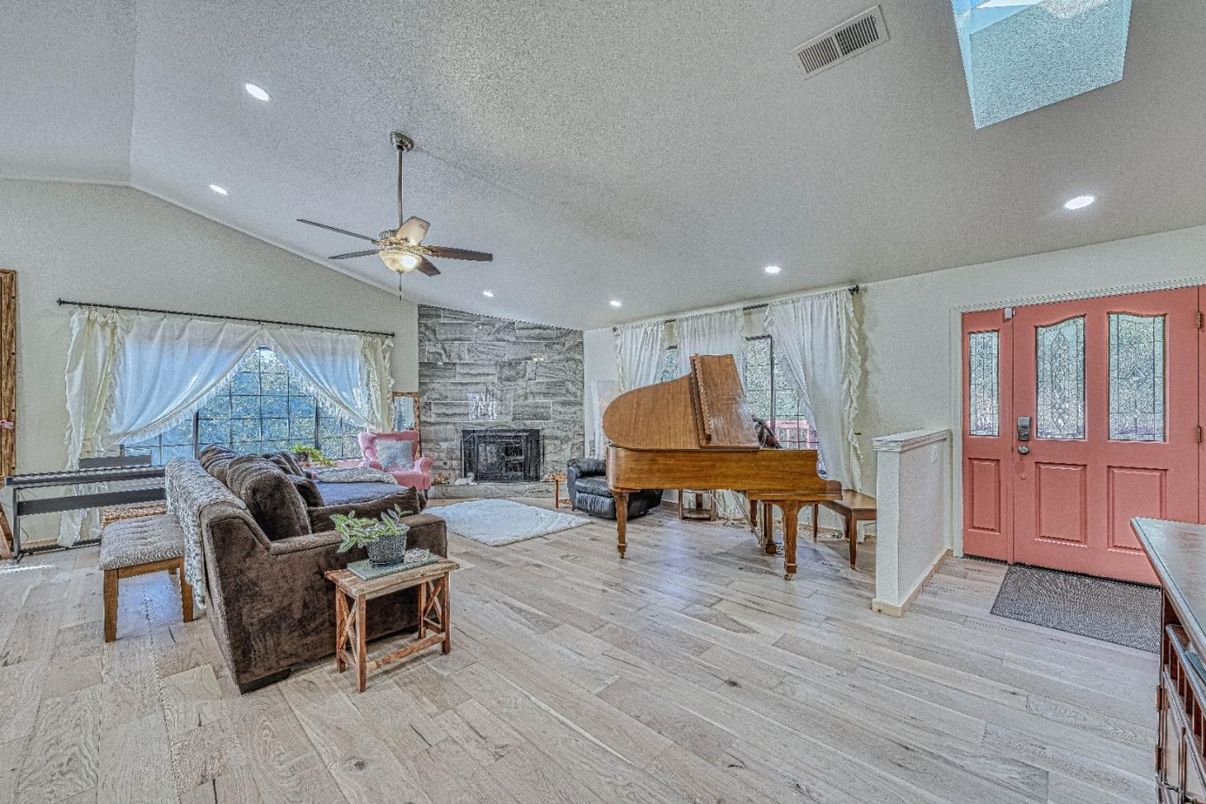 Fireplace, Interior, Living room, Piano, Recessed Lighting, Wood Texture Flooring