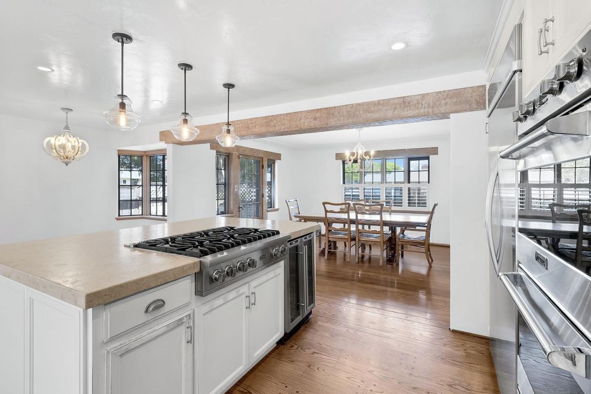 Chandelier, Dining room, Interior, Kitchen, Pendant Lights, Recessed Lighting, Stainless Steel Appliances, Wood Texture Flooring