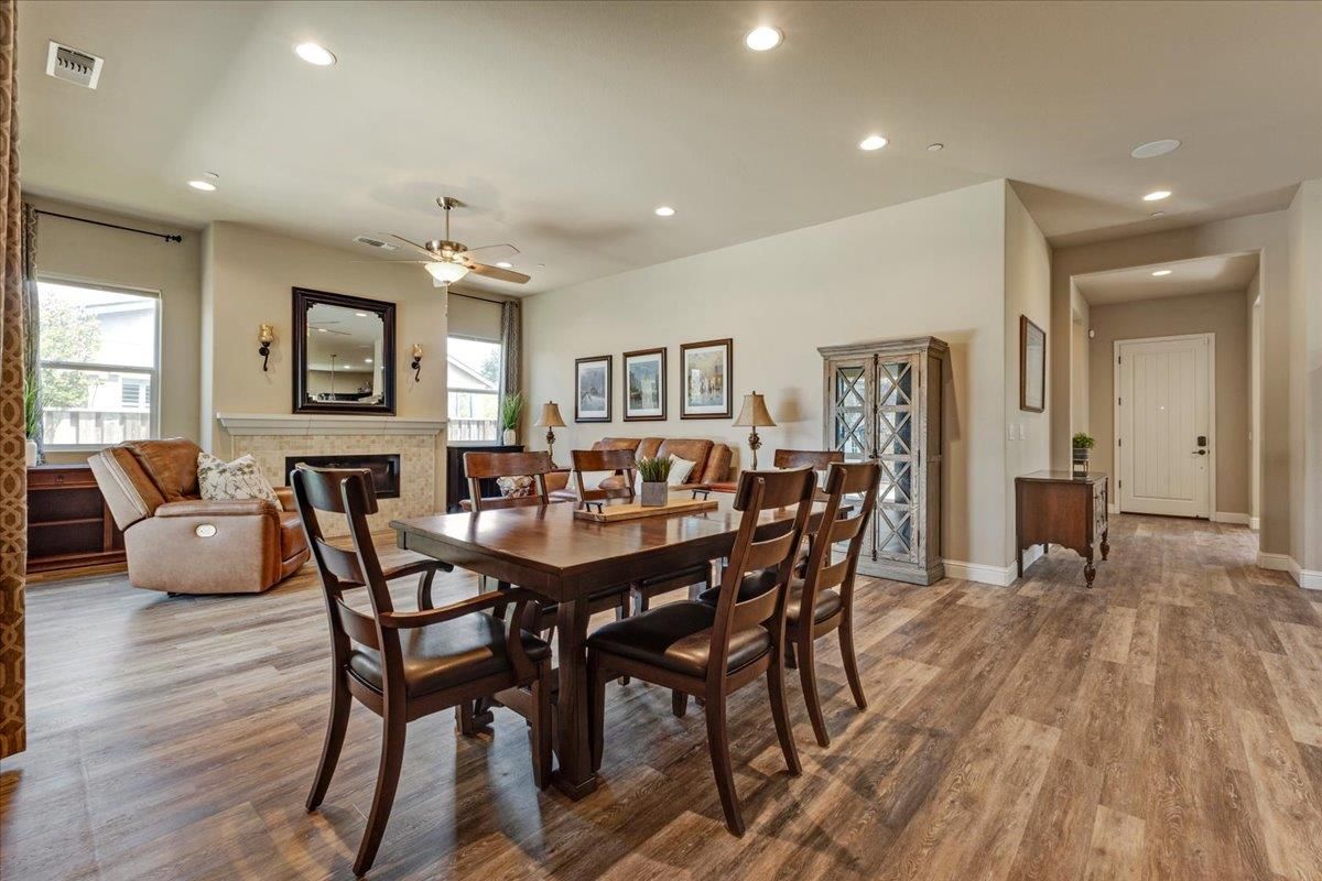 Dining room, Fireplace, Interior, Living room, Recessed Lighting, Wood Texture Flooring