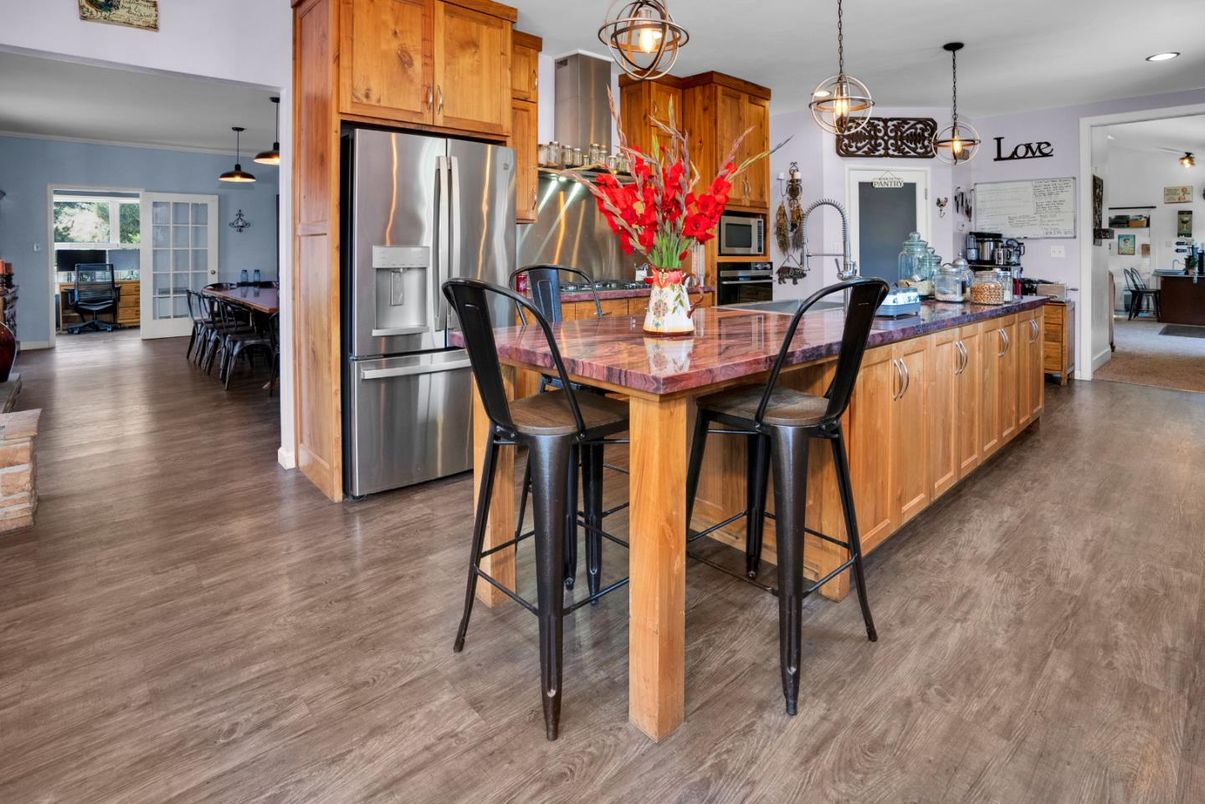 Dining room, Interior, Kitchen, Pendant Lights, Recessed Lighting, Stainless Steel Appliances, Wood Texture Flooring