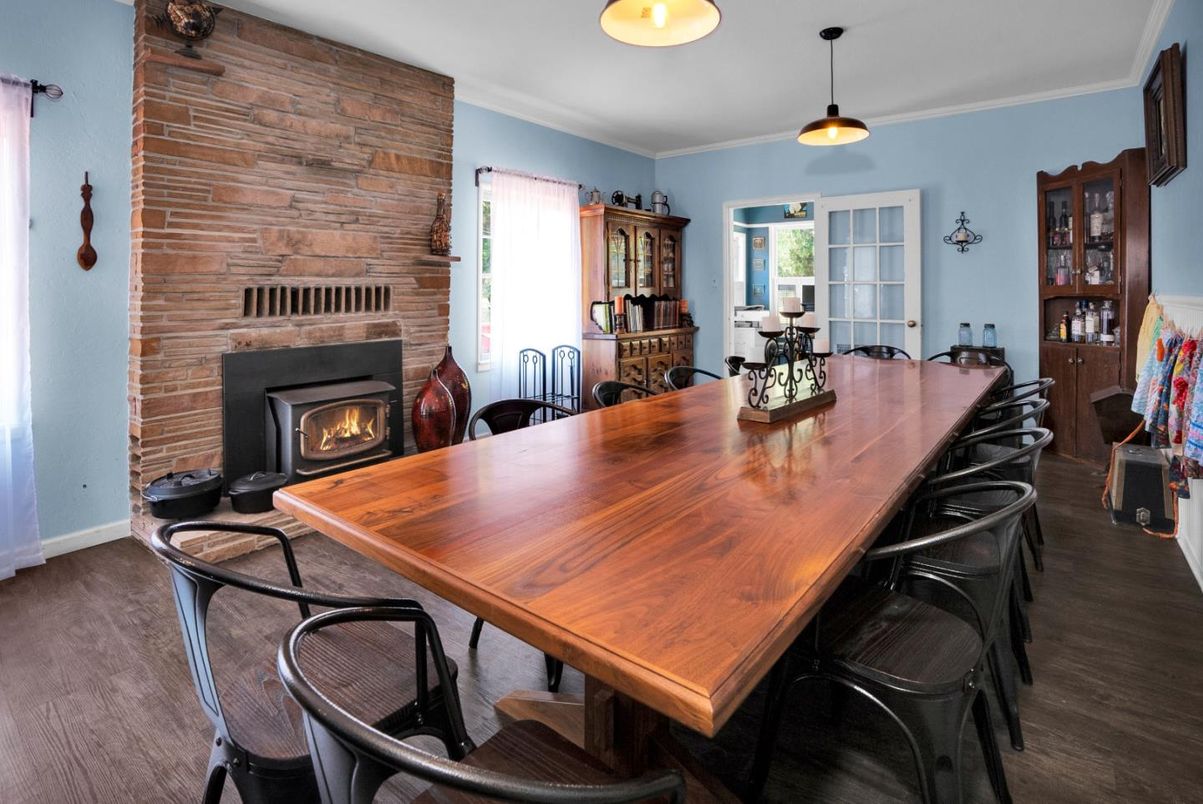 Dining room, Fireplace, Interior, Pendant Lights, Stone Walls, Wood Texture Flooring