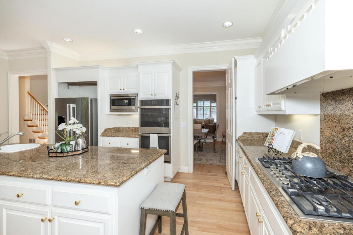Dining room, Interior, Kitchen, Recessed Lighting, Stainless Steel Appliances, Wood Texture Flooring