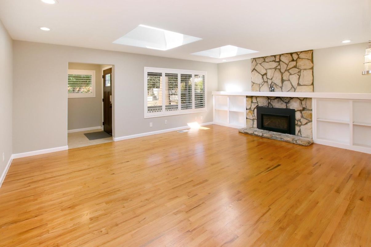 Empty room, Fireplace, Interior, Recessed Lighting, Stone Walls, Wood Texture Flooring
