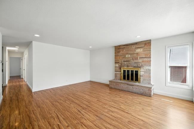 Empty room, Fireplace, Interior, Recessed Lighting, Stone Walls, Wood Texture Flooring, Wooden Walls
