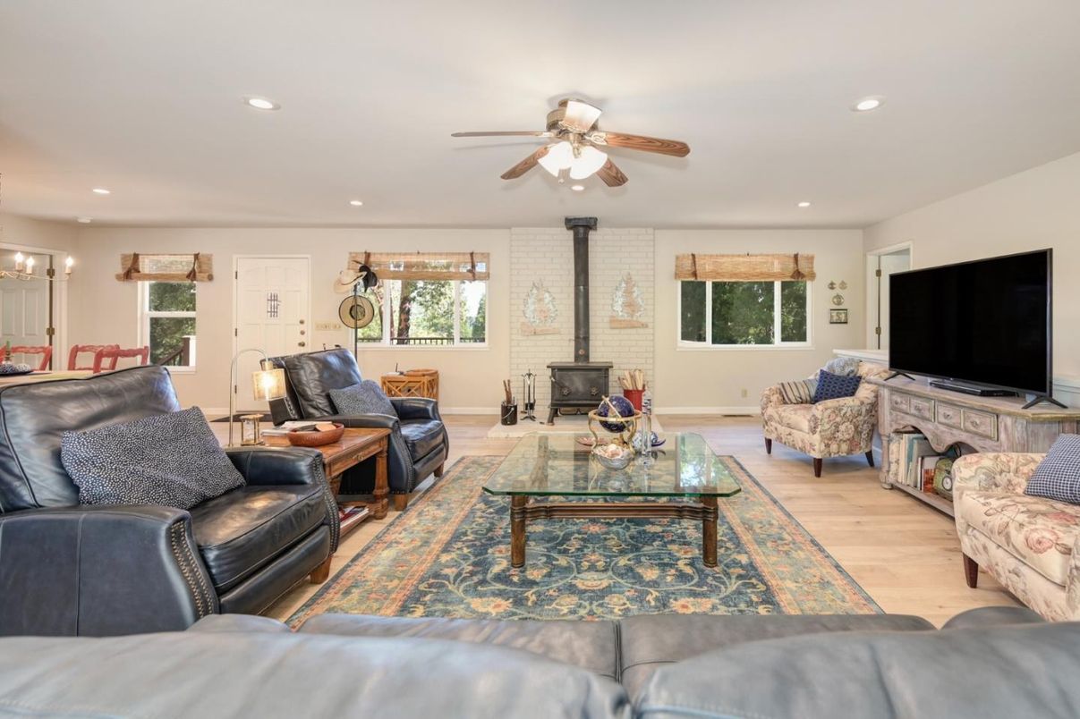 Fireplace, Interior, Living room, Recessed Lighting, Stone Walls, Wood Texture Flooring