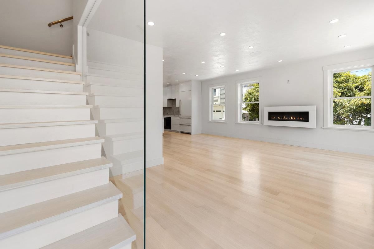 Empty room, Fireplace, Interior, Kitchen, Recessed Lighting, Wood Texture Flooring