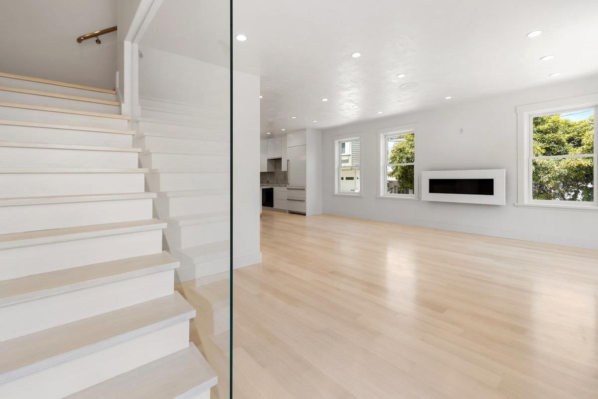 Empty room, Fireplace, Interior, Kitchen, Recessed Lighting, Wood Texture Flooring