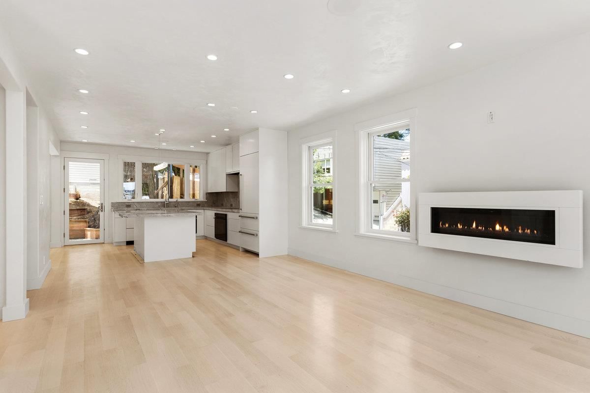 Empty room, Fireplace, Interior, Kitchen, Pendant Lights, Recessed Lighting, Wood Texture Flooring