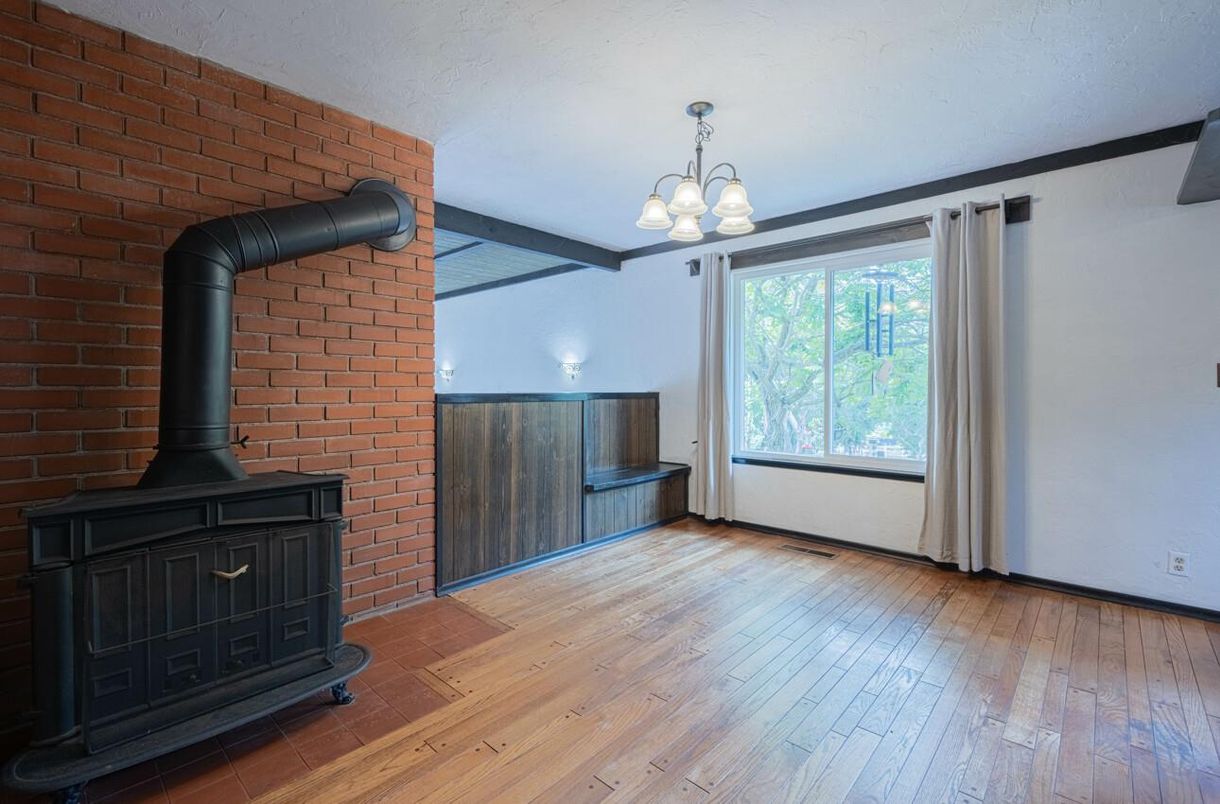 Chandelier, Empty room, Fireplace, Interior, Stone Walls, Wood Texture Flooring