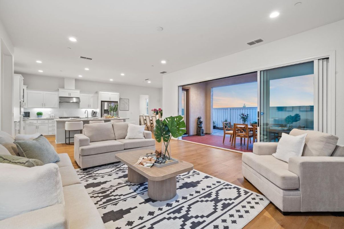Dining room, Interior, Kitchen, Living room, Recessed Lighting, Stainless Steel Appliances, Water, Wood Texture Flooring