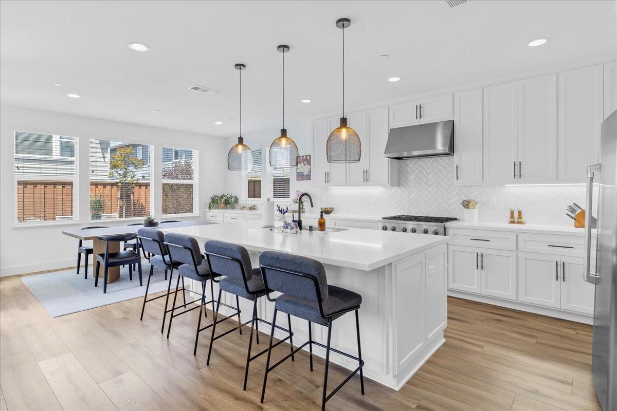Dining room, Interior, Kitchen, Pendant Lights, Recessed Lighting, Stainless Steel Appliances, Wood Texture Flooring