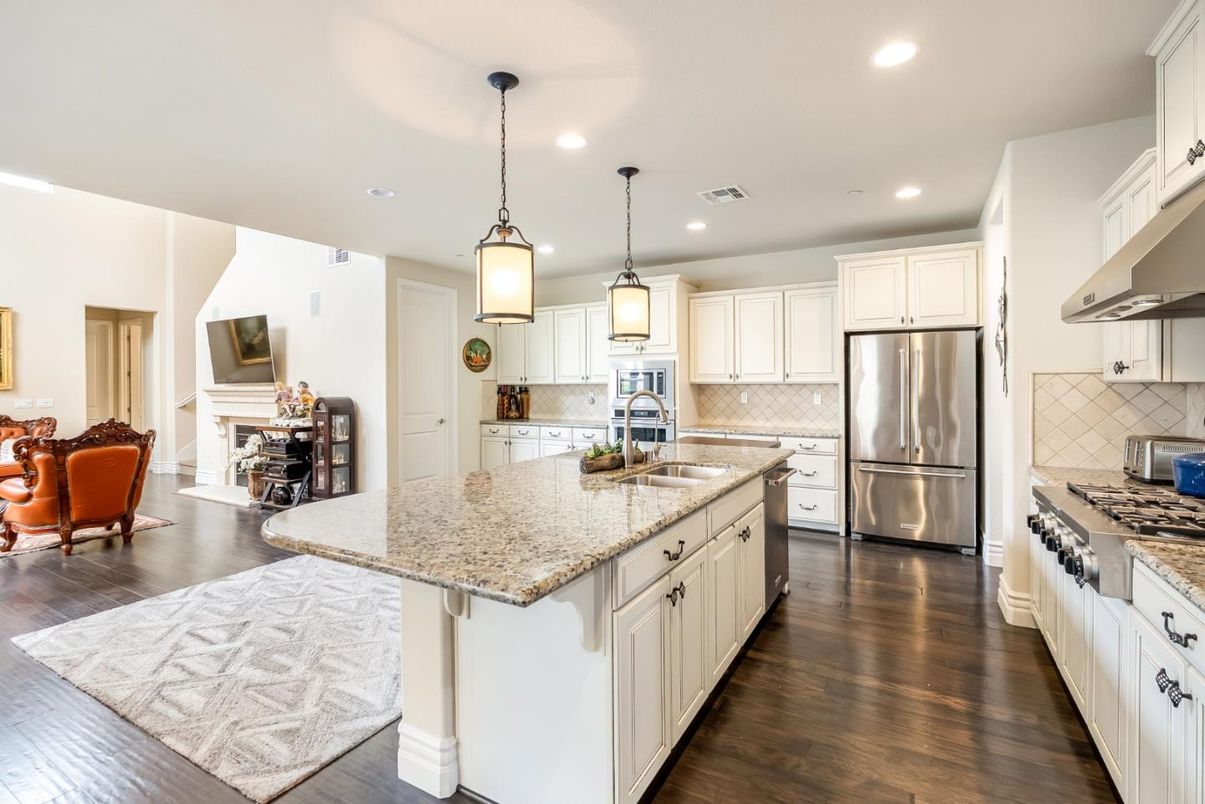 Fireplace, Interior, Kitchen, Pendant Lights, Recessed Lighting, Stainless Steel Appliances, Wood Texture Flooring