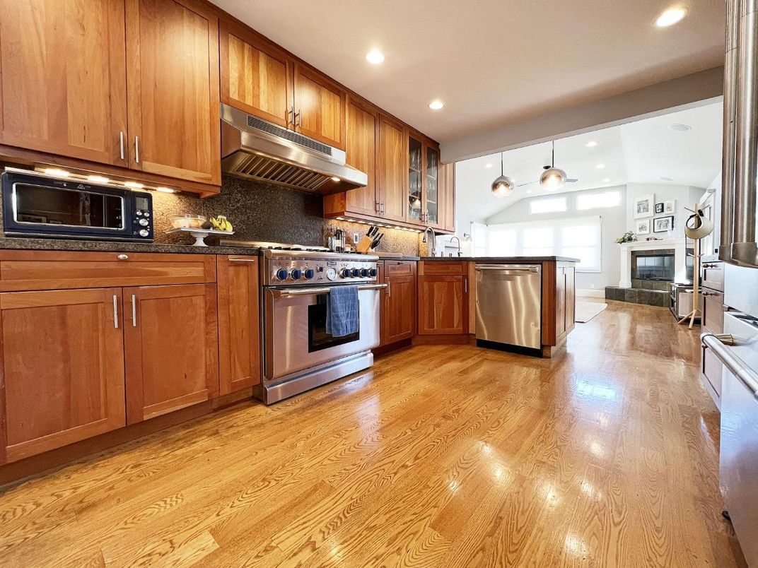 Fireplace, Interior, Kitchen, Recessed Lighting, Stainless Steel Appliances, Wood Texture Flooring