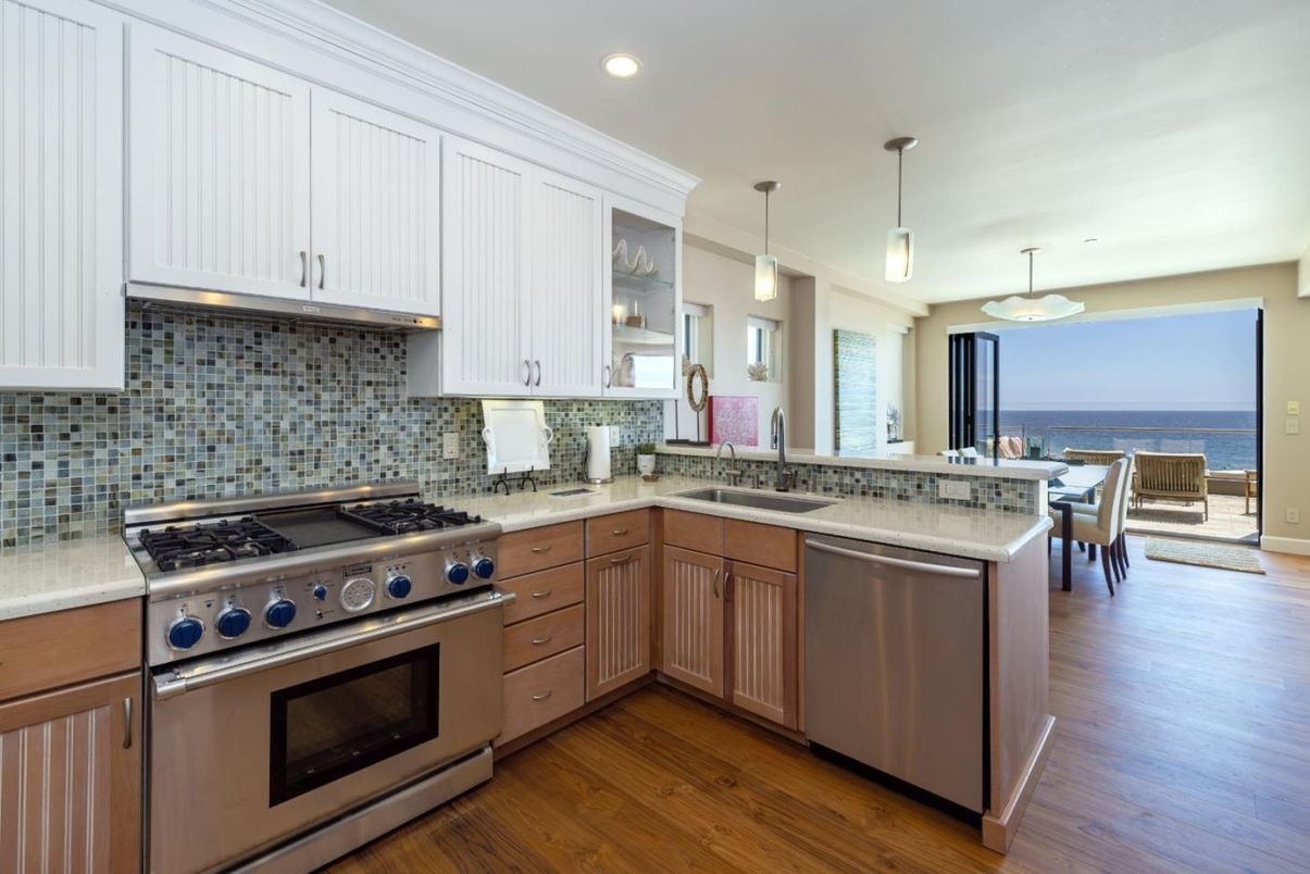 Dining room, Interior, Kitchen, Pendant Lights, Recessed Lighting, Stainless Steel Appliances, Water, Wood Texture Flooring