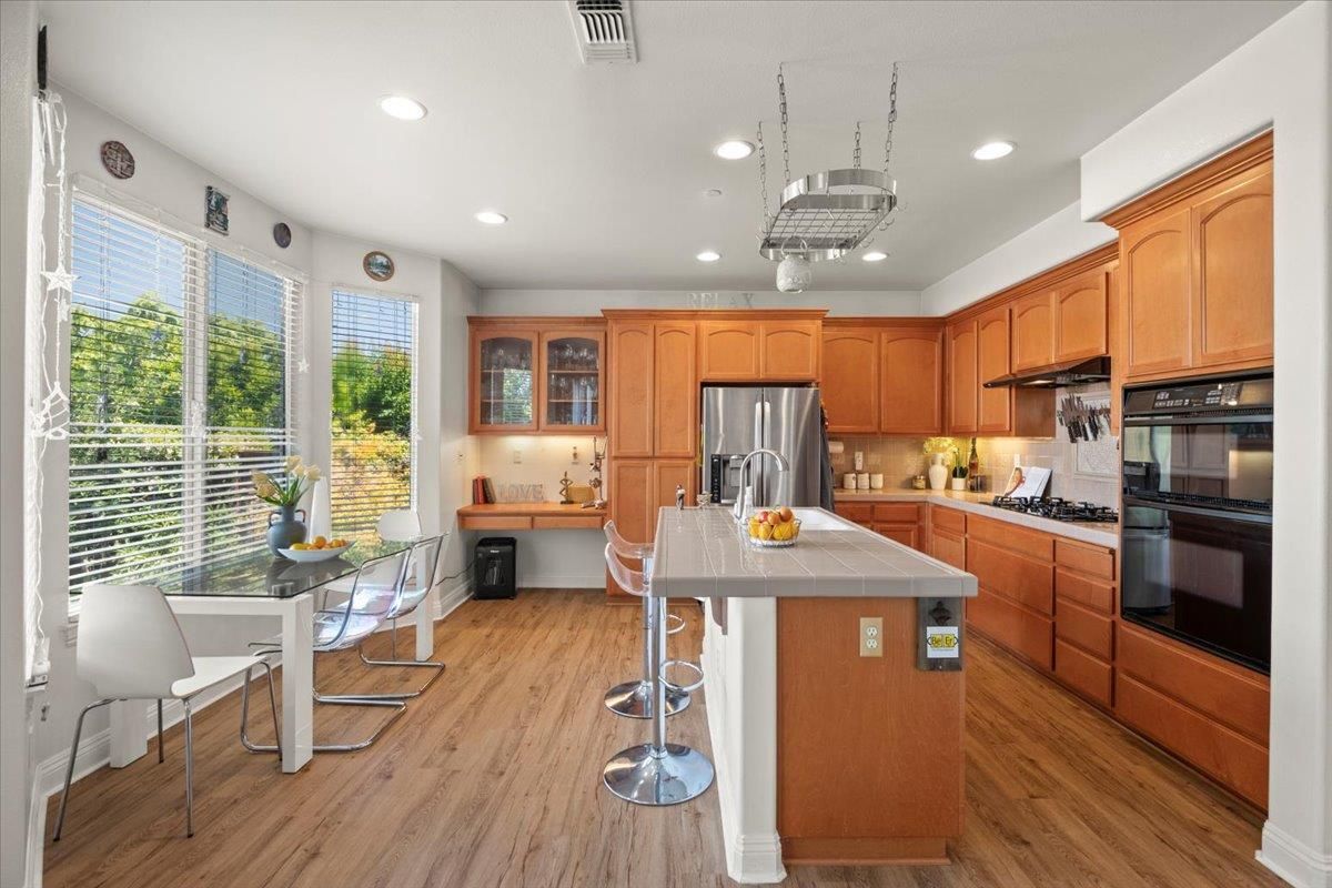 Dining room, Interior, Kitchen, Recessed Lighting, Stainless Steel Appliances, Wood Texture Flooring