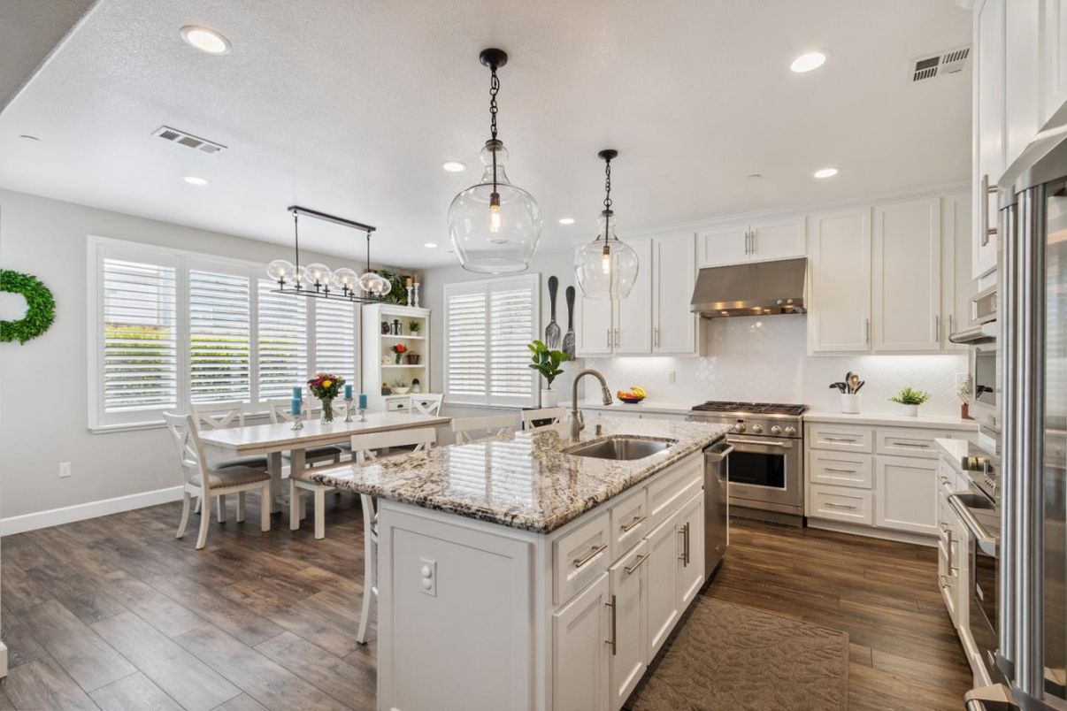 Chandelier, Dining room, Interior, Kitchen, Pendant Lights, Recessed Lighting, Stainless Steel Appliances, Wood Texture Flooring
