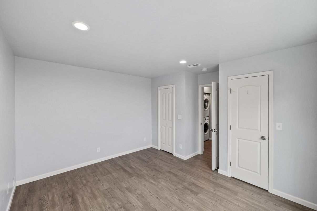 Empty room, Interior, Recessed Lighting, Utility Closets, Washer, Wood Texture Flooring