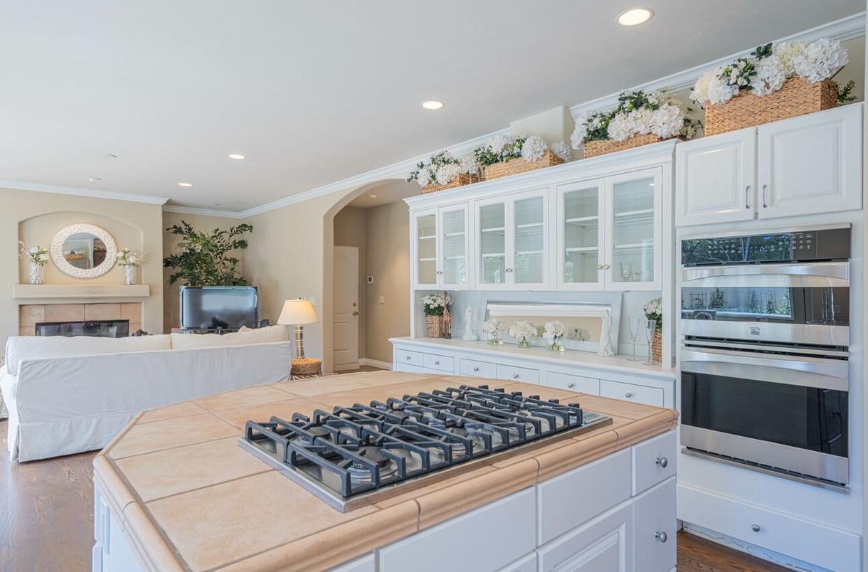 Fireplace, Interior, Kitchen, Living room, Recessed Lighting, Stainless Steel Appliances, Wood Texture Flooring