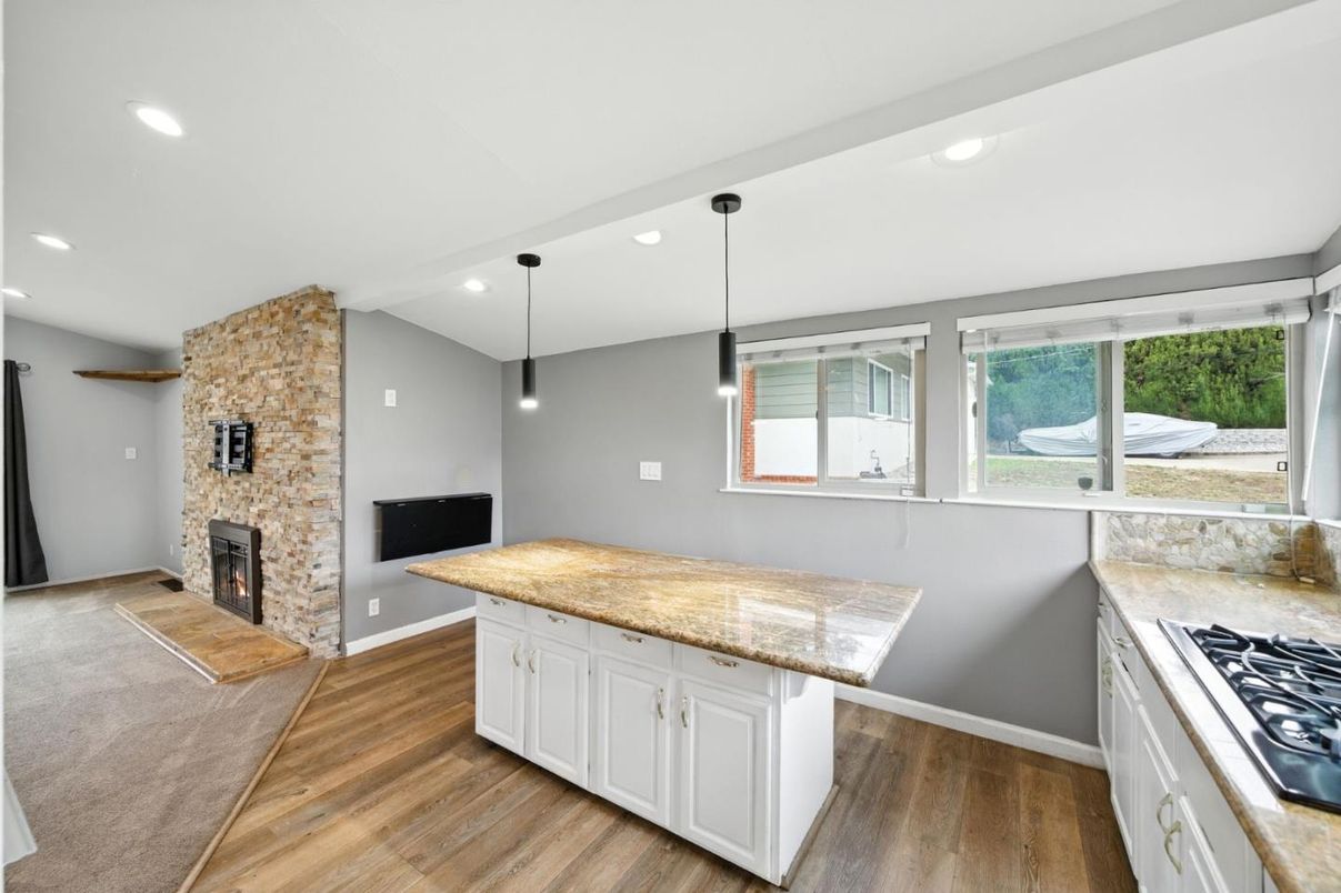 Fireplace, Interior, Kitchen, Pendant Lights, Recessed Lighting, Stone Walls, Wood Texture Flooring