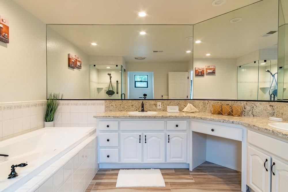 Bathroom, Dual Sink Vanities, Glass Shower, Interior, Recessed Lighting, Wood Texture Flooring
