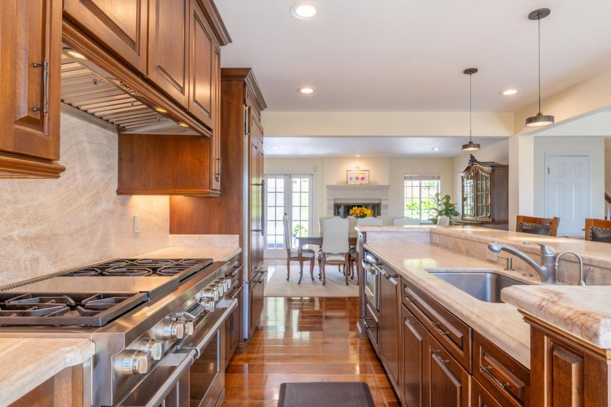 Dining room, Fireplace, Interior, Kitchen, Pendant Lights, Recessed Lighting, Stainless Steel Appliances, Wood Texture Flooring