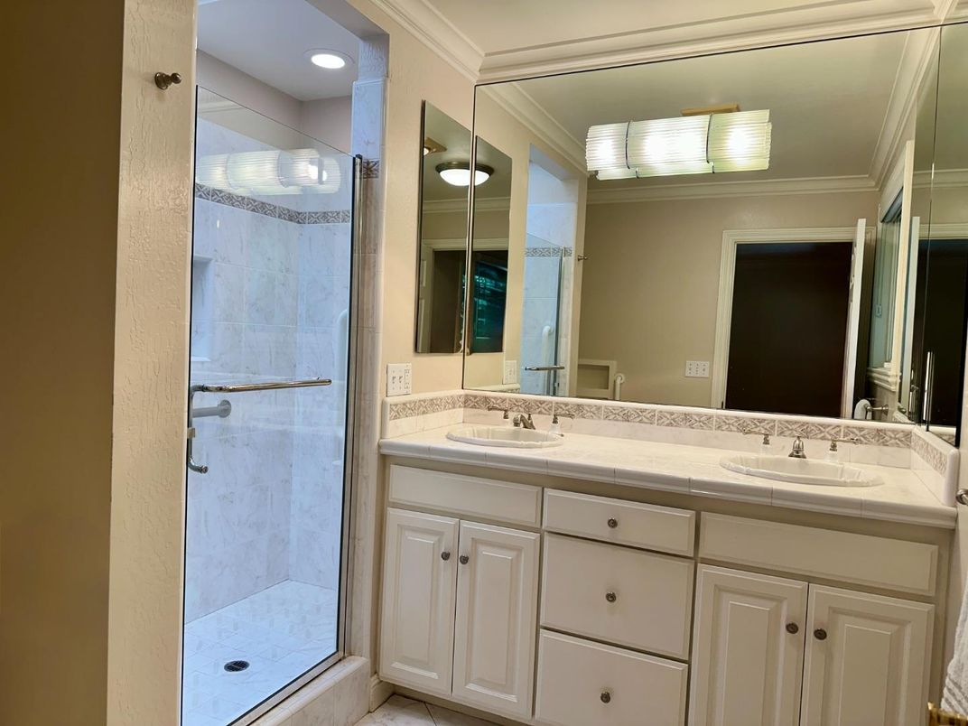 Bathroom, Dual Sink Vanities, Glass Shower, Interior, Recessed Lighting, Tile Countertops