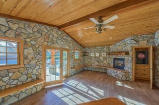 Empty room, Fireplace, Interior, Recessed Lighting, Stone Walls, Wooden Beams, Wooden Ceilings, Wood Texture Flooring