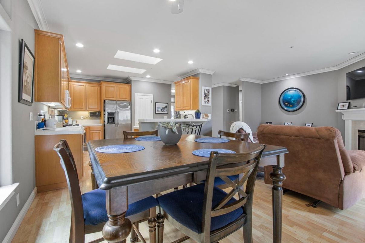 Dining room, Fireplace, Interior, Kitchen, Recessed Lighting, Stainless Steel Appliances, Wood Texture Flooring