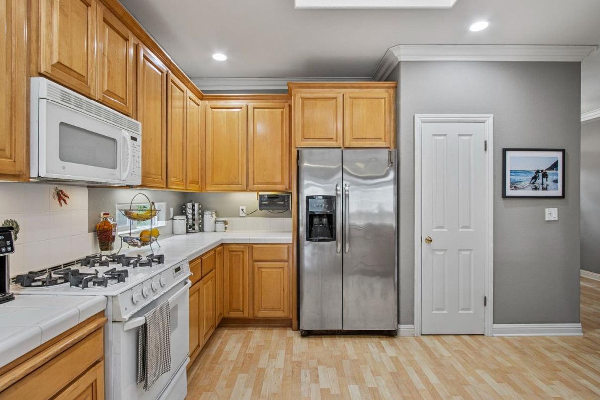 Interior, Kitchen, Recessed Lighting, Tile Countertops, Wood Texture Flooring