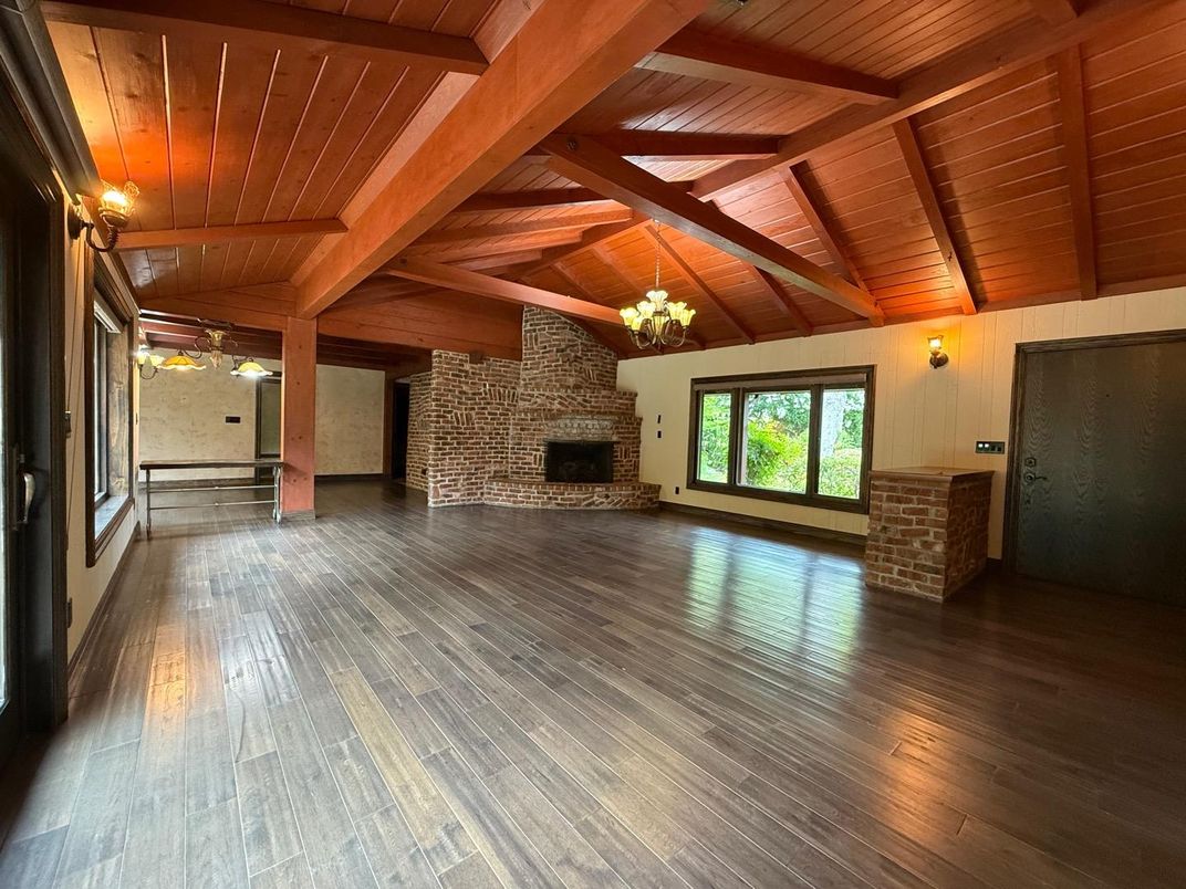 Chandelier, Empty room, Fireplace, Interior, Stone Walls, Wooden Beams, Wooden Ceilings, Wood Texture Flooring