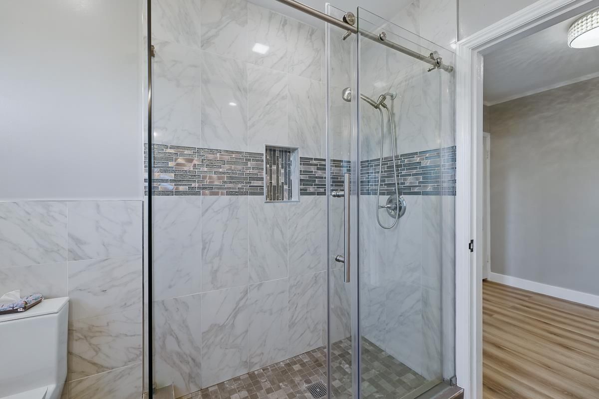 Bathroom, Glass Shower, Interior, Marble Walls, Wood Texture Flooring