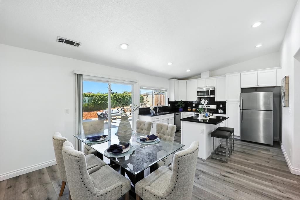 Dining room, Interior, Kitchen, Recessed Lighting, Stainless Steel Appliances, Wood Texture Flooring